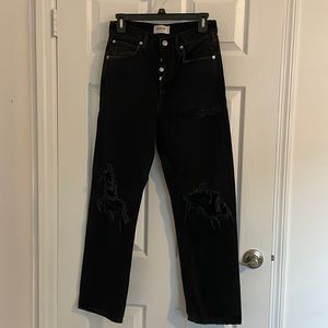 Agolde LA black jeans wide leg with rips in thigh and knees